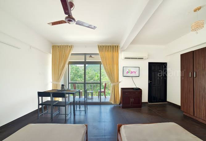 Patient room with balcony at AKAMI Ayurveda Hospital